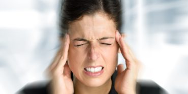 Businesswoman,With,Intense,Stress,And,Painful,Headache.,Woman,In,Job